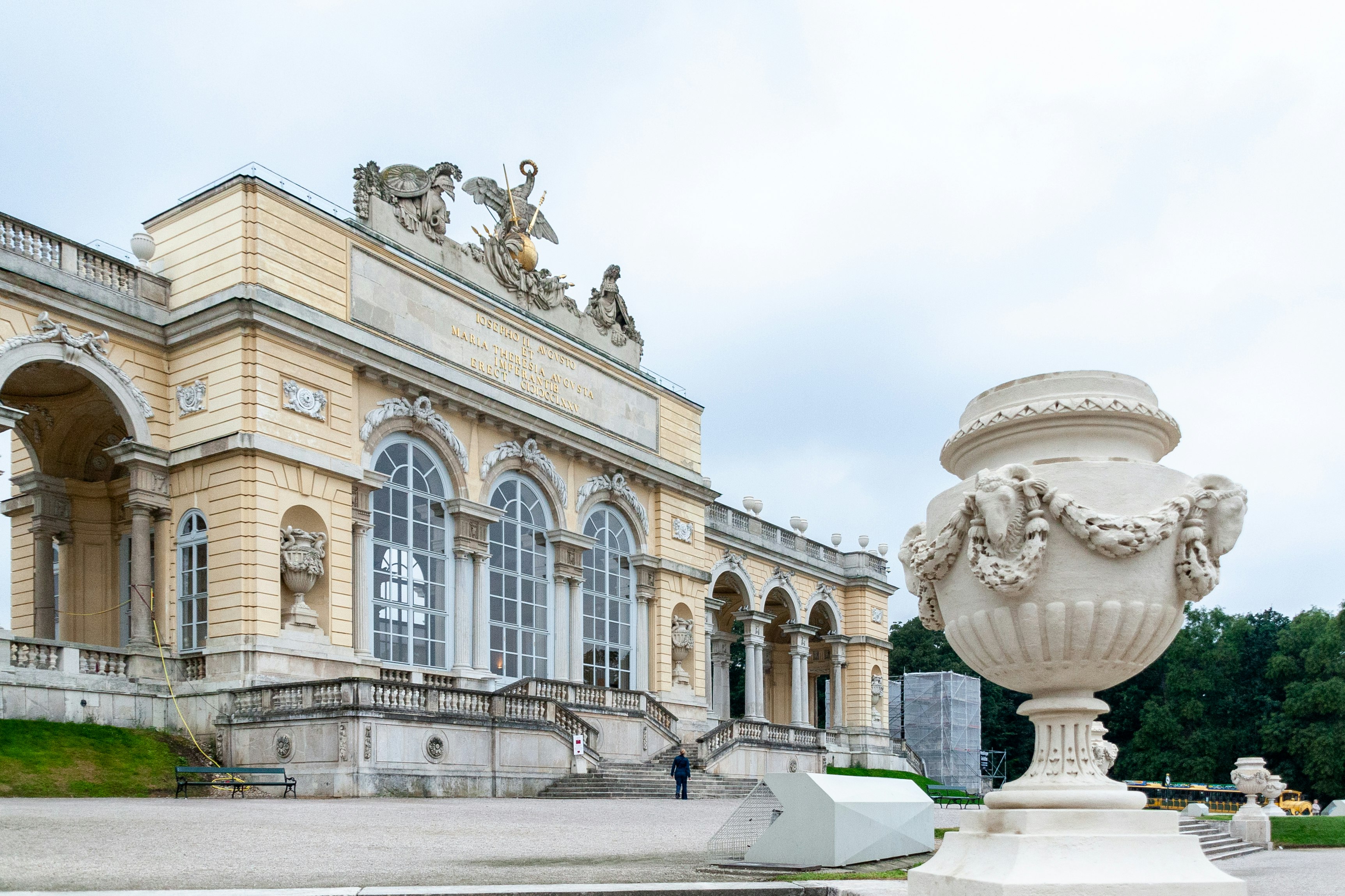 white concrete building with statues